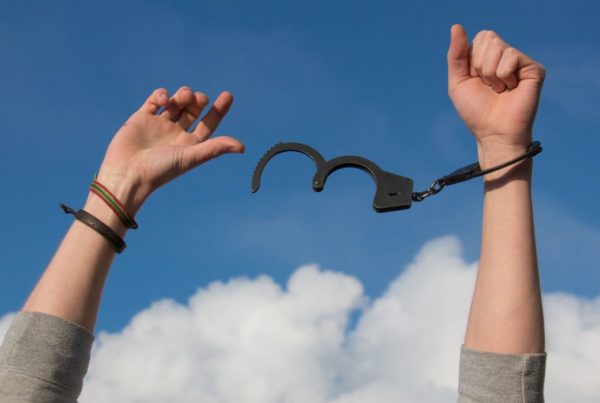 Woman unlocking handcuffs